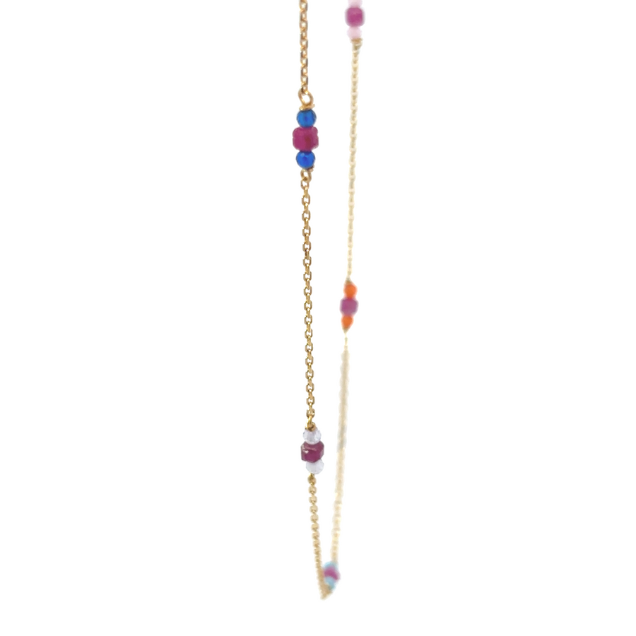 Adjustable 14k gold necklace laid flat showing clasp and extension chain
