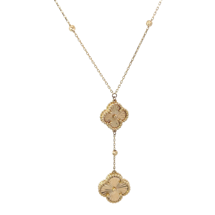 14k gold necklace with small and medium pendants on white background