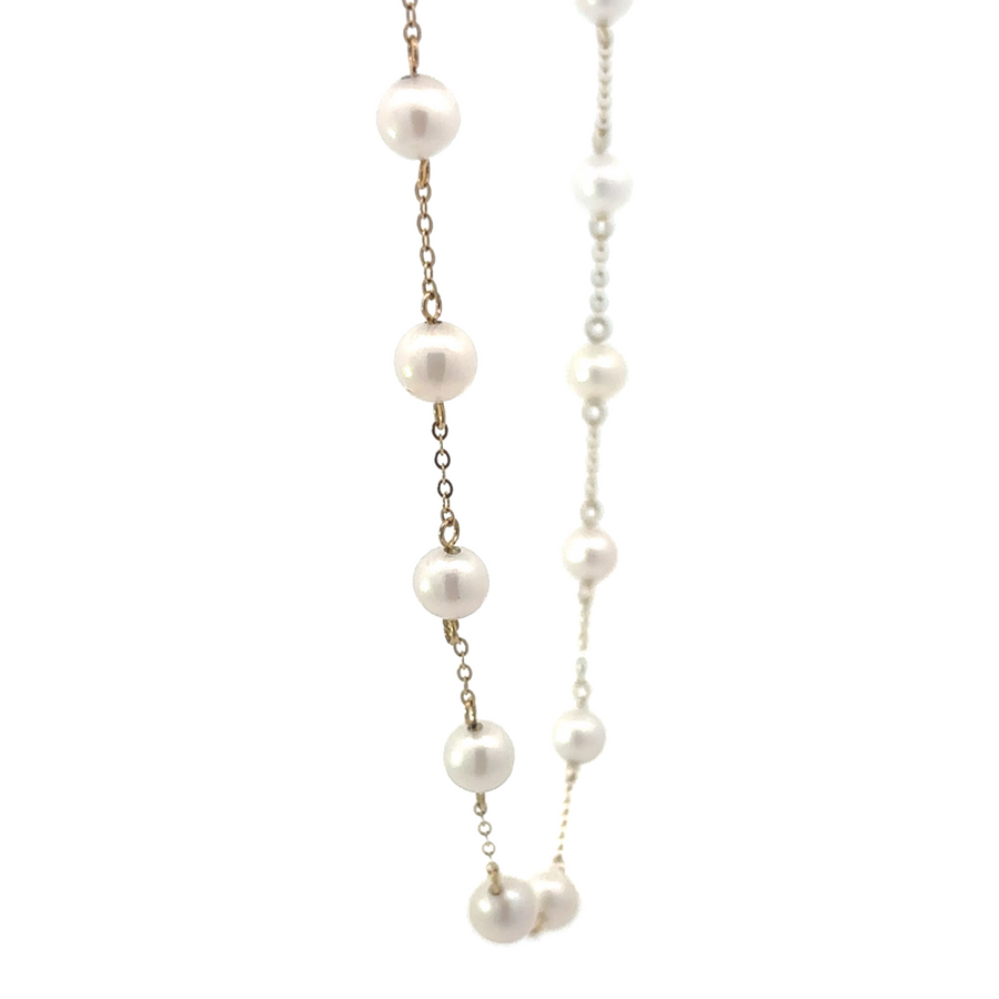 Elegant 22-inch pearl necklace with warm gold accents
