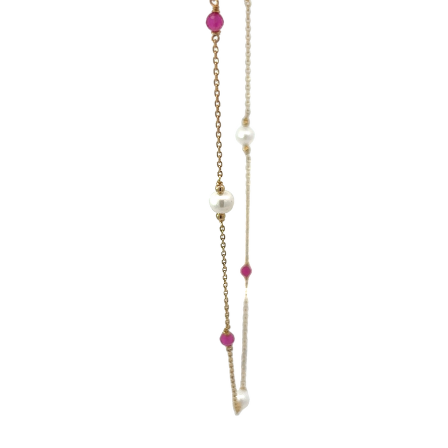 Detail view of adjustable 14k gold necklace with XXS stones and pearls