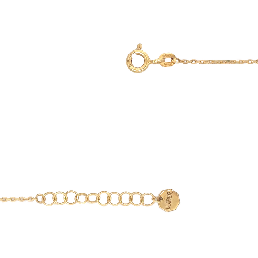 Close-up of the 14k gold necklace with a feminine design of stones and pearls
