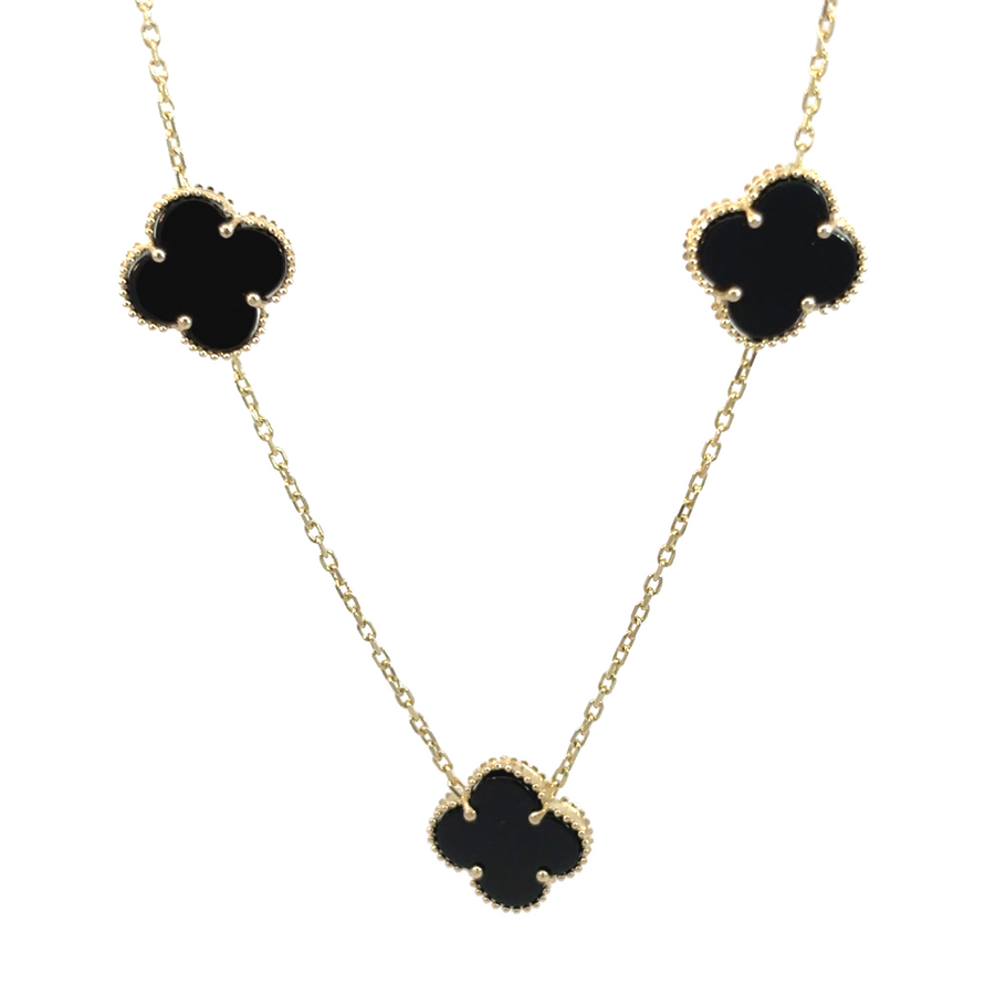 14k gold necklace with five black stones on a white background
