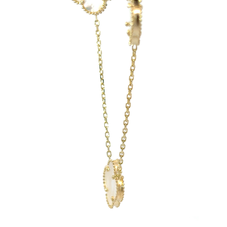 Model wearing 14k gold necklace with v-neck dress