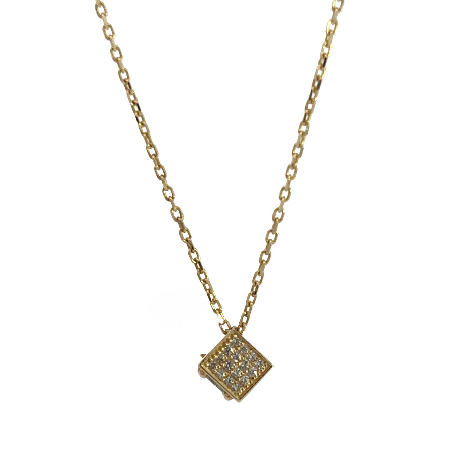 Close-up of blue cubes on delicate 14k gold chain