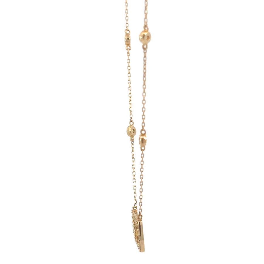 Elegant woman wearing adjustable 14k gold necklace with CZ stones