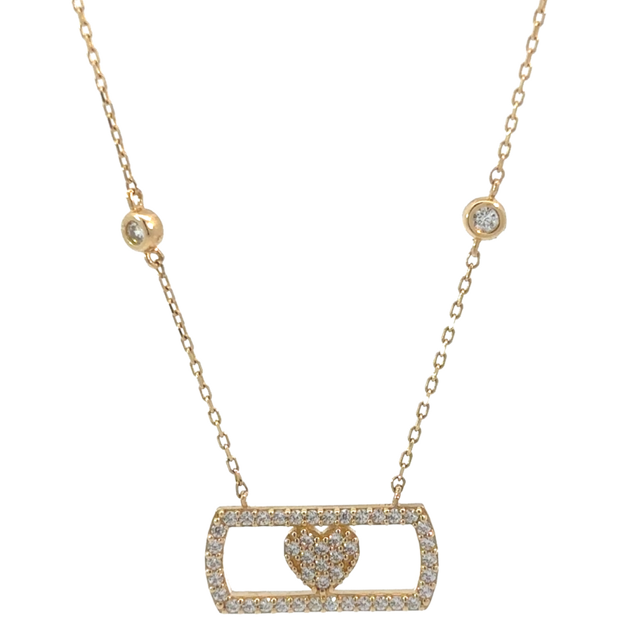 14k gold necklace with cubic zirconia stones, displayed on a black velvet background