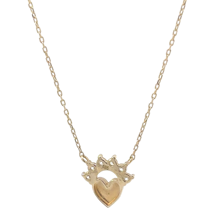 Detailed shot of the heart charm in the 14k gold necklace, emphasizing its elegance and craftsmanship.