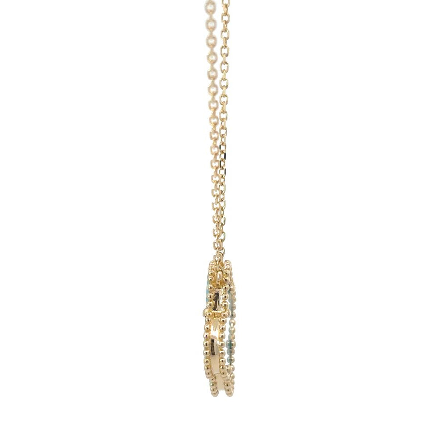 Model wearing the 14k gold necklace with center turquoise, styled with a simple outfit