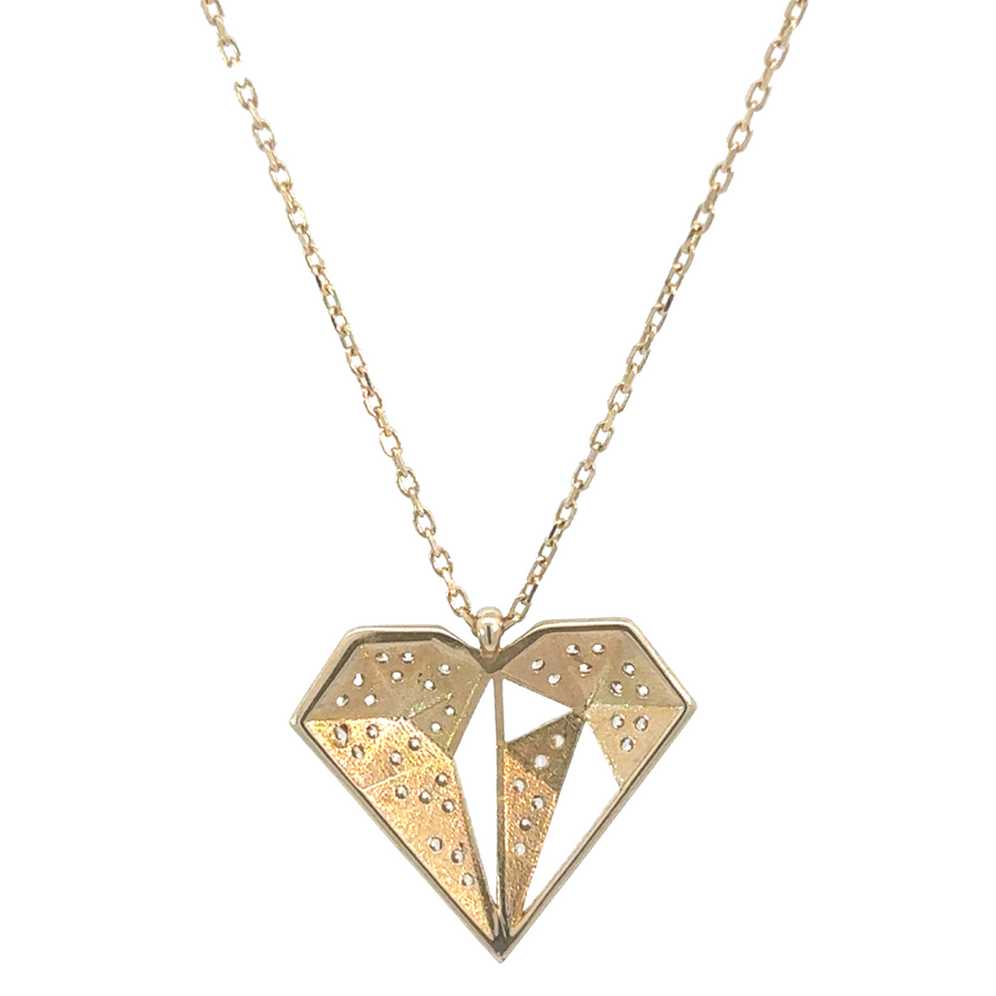 14k gold necklace with diamond-style CZ stones laid on luxurious fabric
