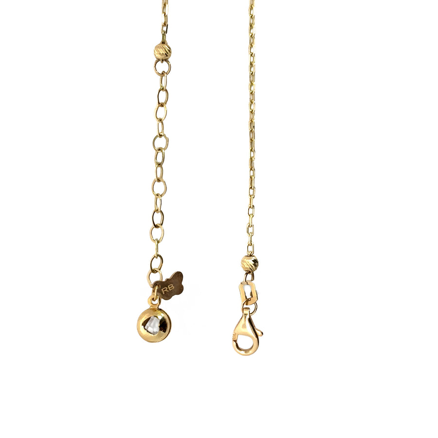 Necklace laid flat with alternating green and glitter accents