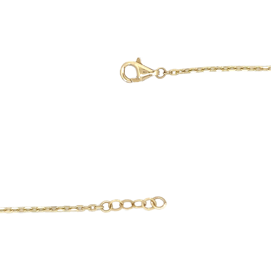 Flat lay of necklace on marble background with matching earrings