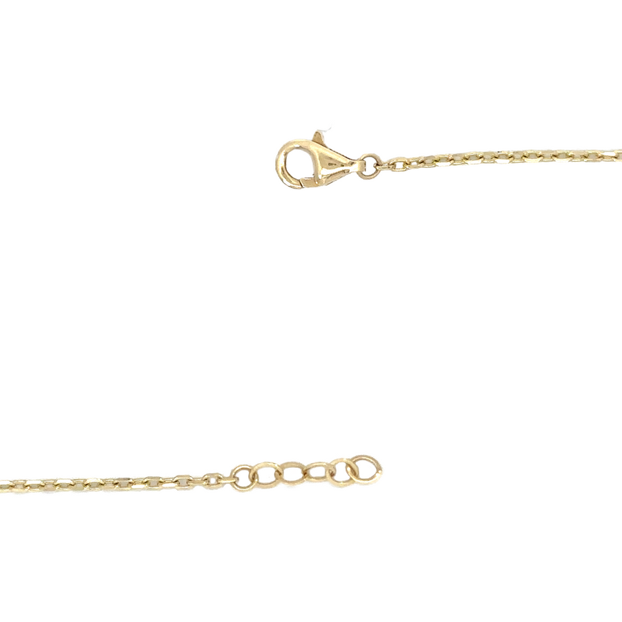 Model wearing gold necklace with green stone for women