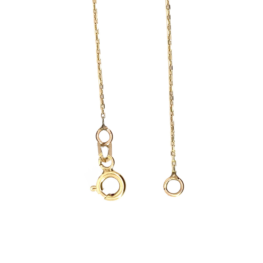 Necklace laid flat with heart and diamond pendant displayed