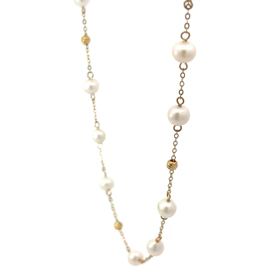 Elegant 27-inch necklace featuring 35 pearls and 10 gold beads