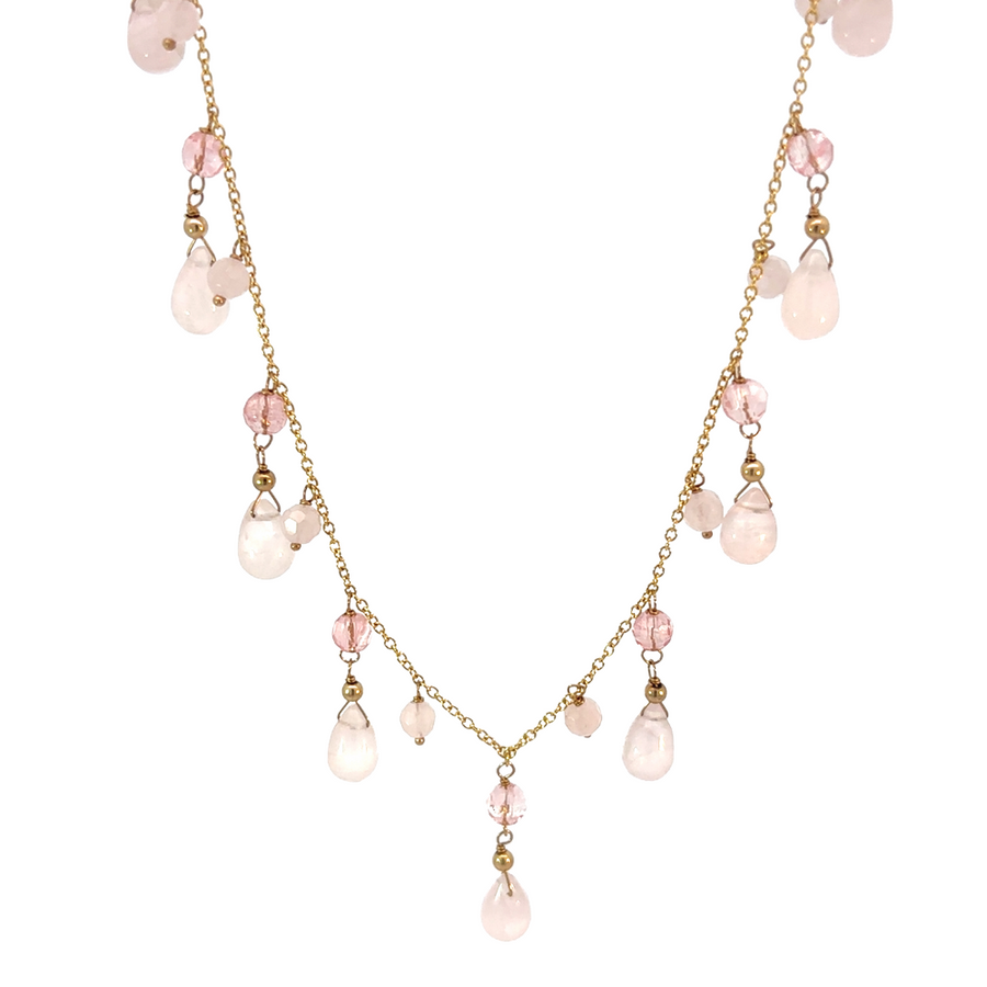 Close-up of the 14k gold necklace with quartz centerpiece against a white background.