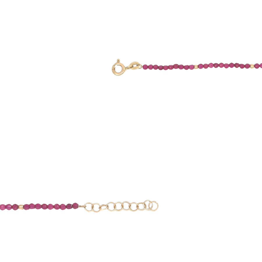 Model wearing red corundum necklace with formal attire