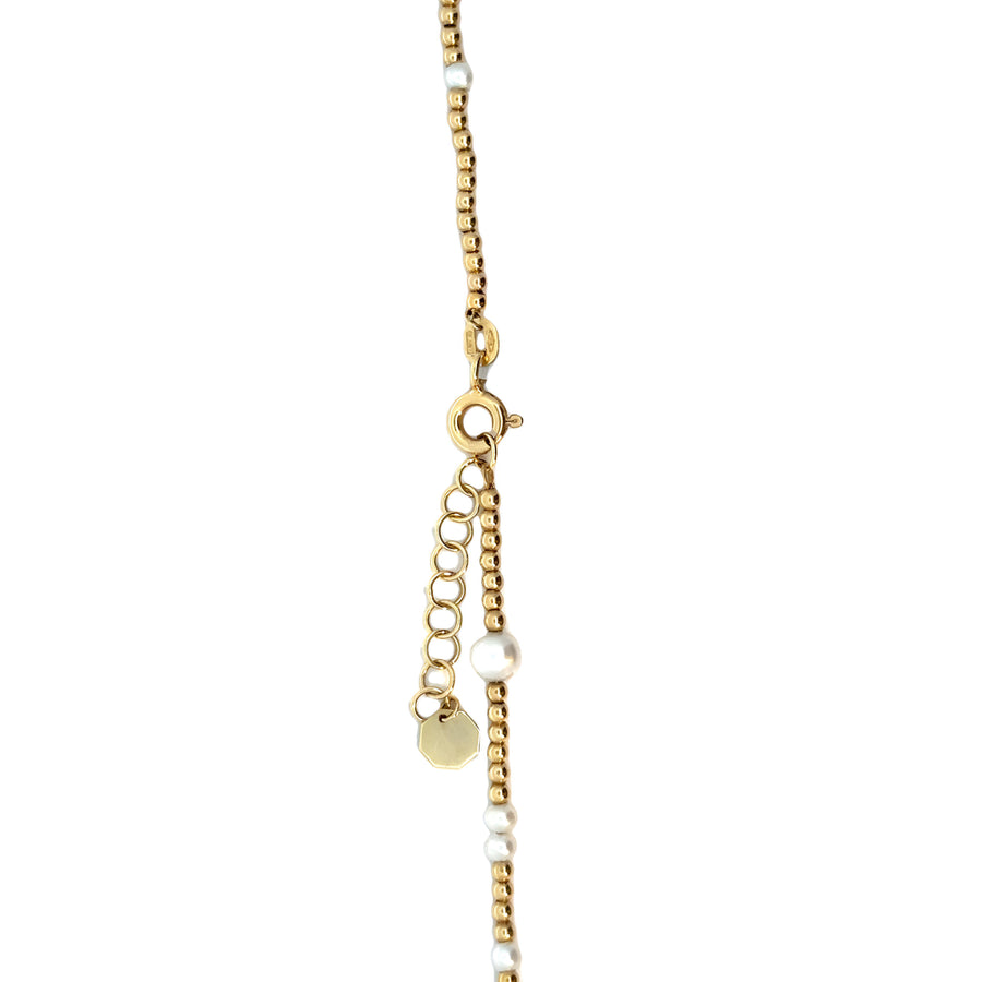 Necklace laid flat showing pearl and adjustable clasp