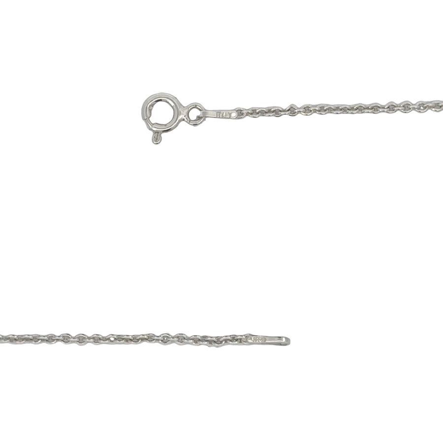 Close-up of butterfly pendant on gold chain