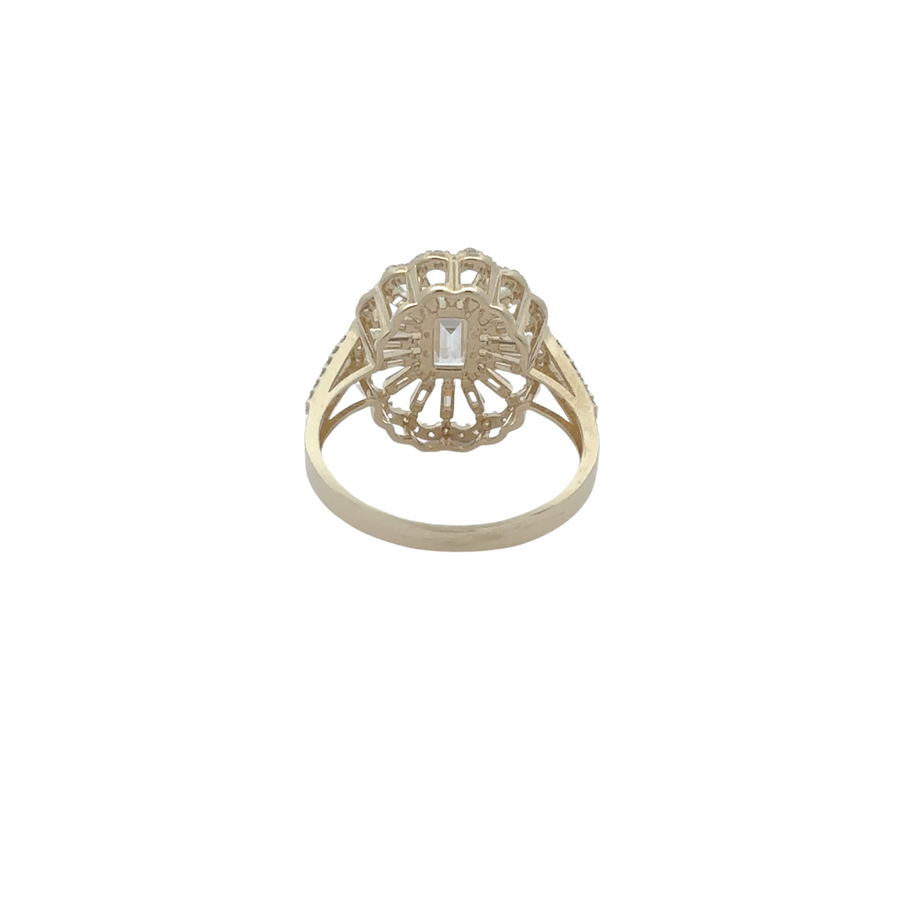 Oval CZ ring with smaller cubic zirconia accents on gold band
