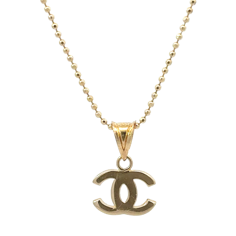 Classic 14k gold unisex pendant on plain white background