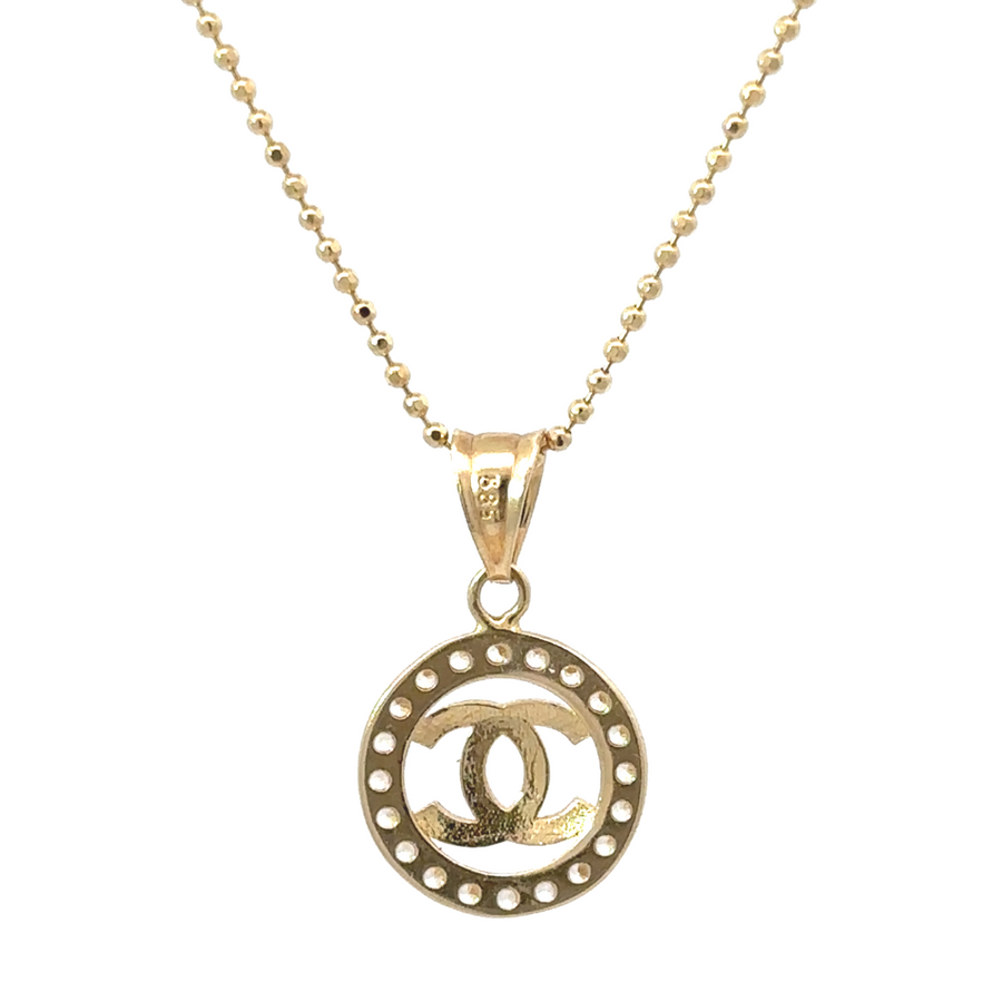 14k gold pendant styled with delicate gold chain