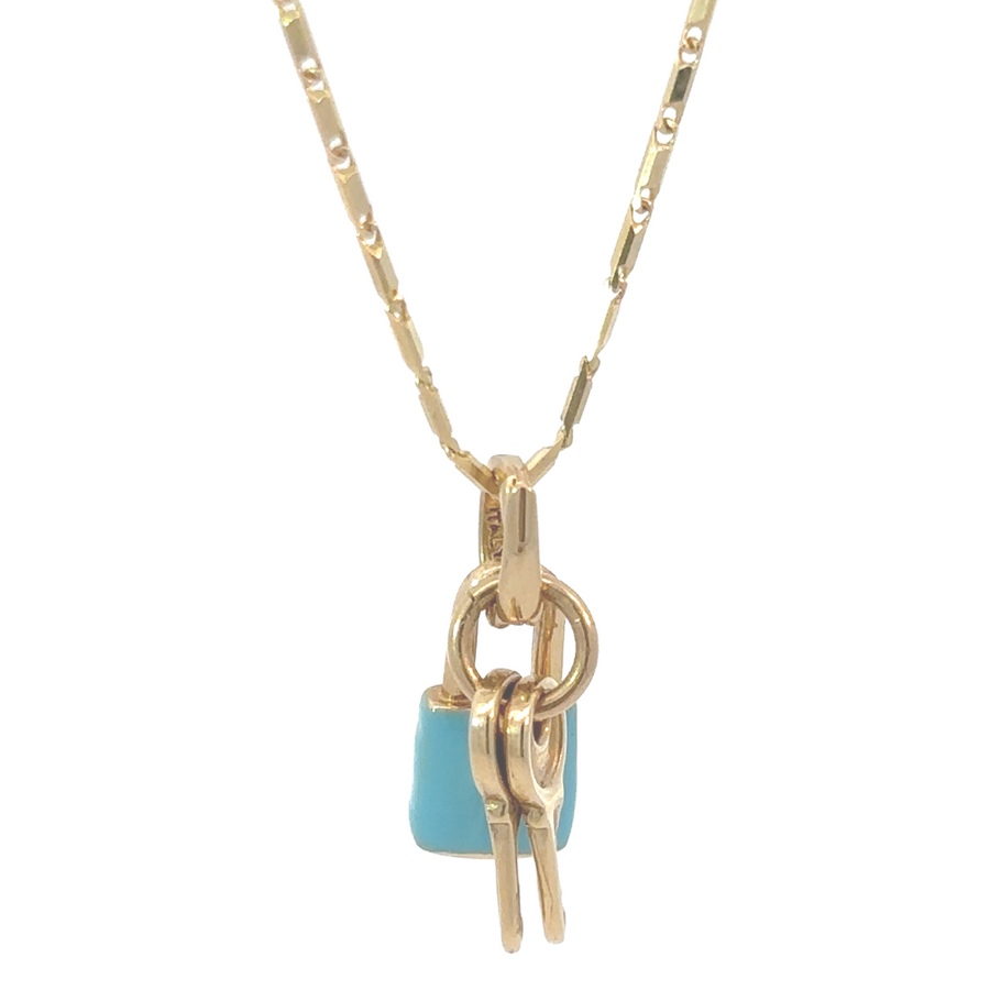 14k gold pendant with blue enamel and two gold key charms, symbolizing luck and opportunity