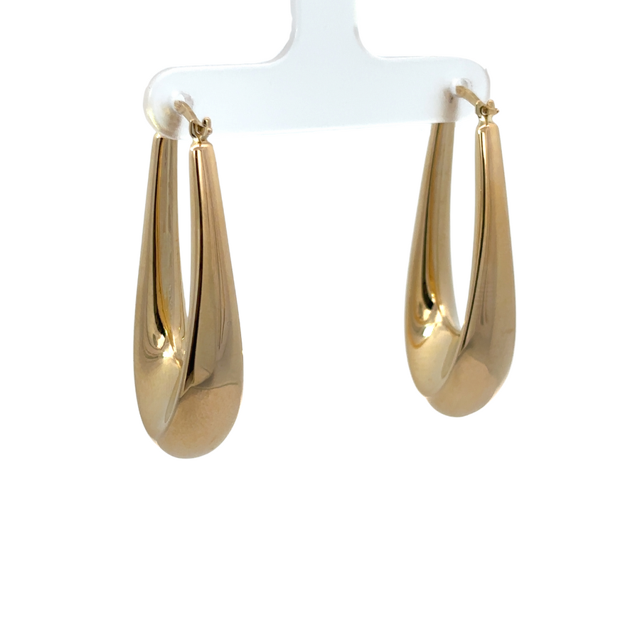 Close-up of 14k gold rectangular drop earrings