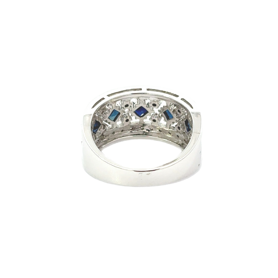 Detailed view of diamonds and sapphires in gold ring and earrings