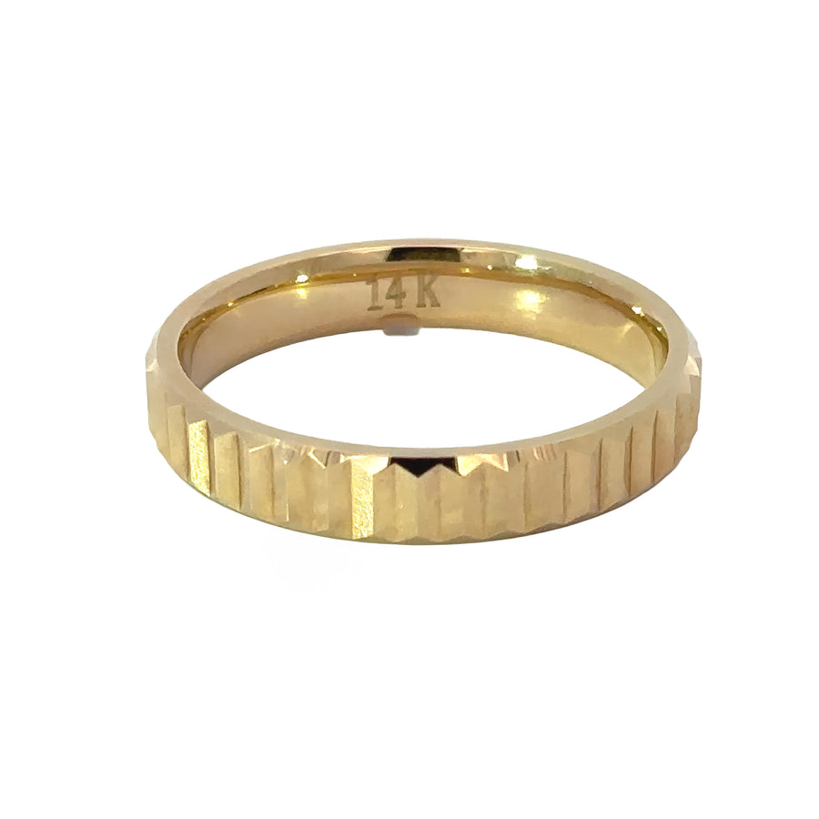 Timeless men’s gold ring displayed on white surface