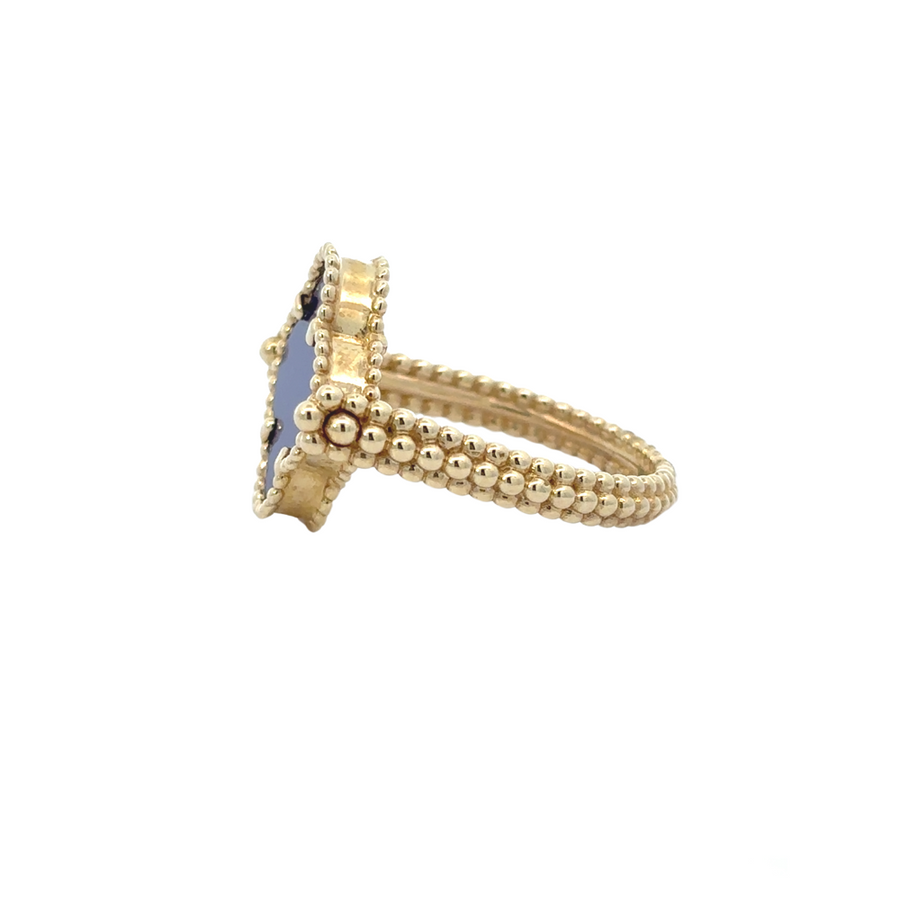 Woman wearing 14k gold ring on ring finger with neutral manicure