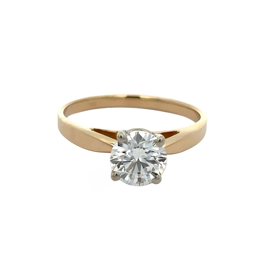 Close-up of solitaire diamond ring in 14k gold