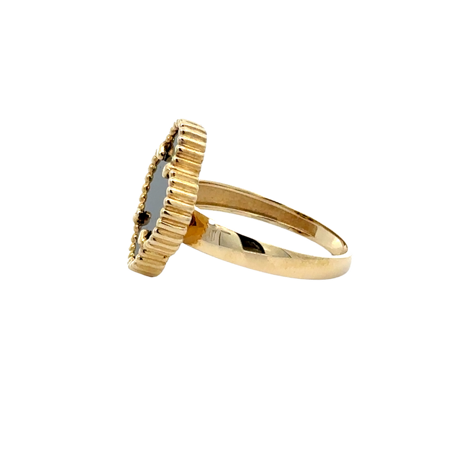 Side view of 14k gold ring with black accent, highlighting its elegant design