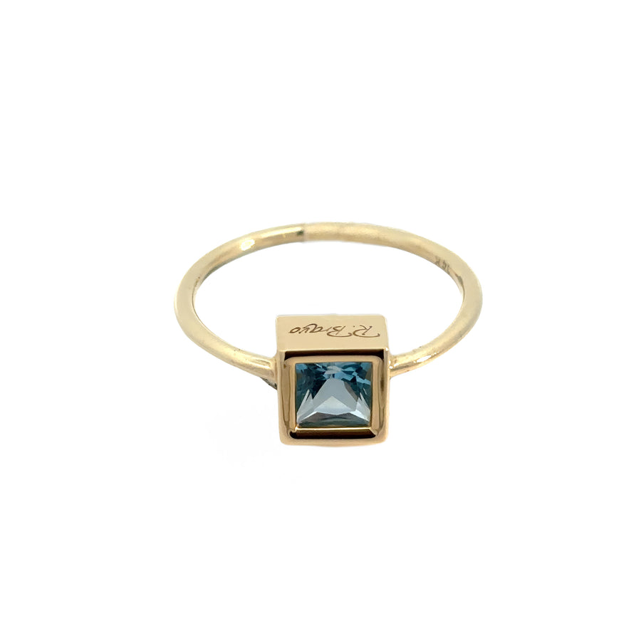 Close-up of blue gemstone set in 14k gold ring size 7
