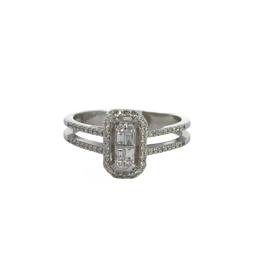 Women's gold ring with sparkling diamond on neutral background