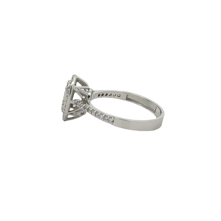 Close-up of 14k gold ring featuring unique CZ drop detail