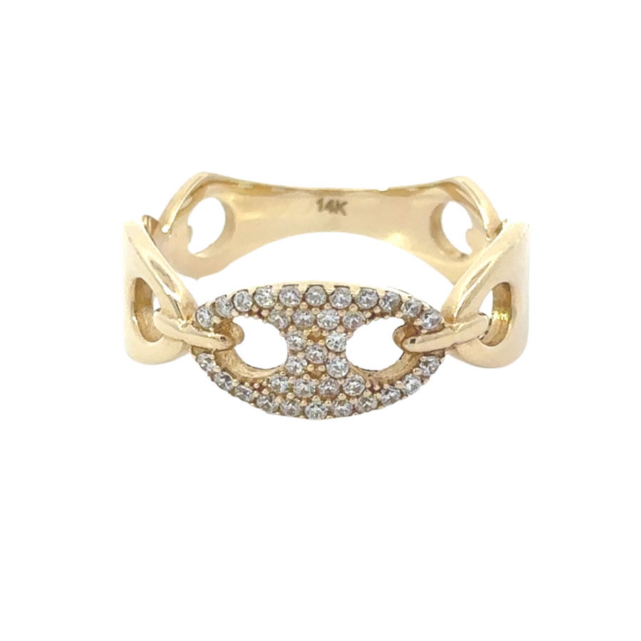 14k gold ring with CZ stones on a white display stand