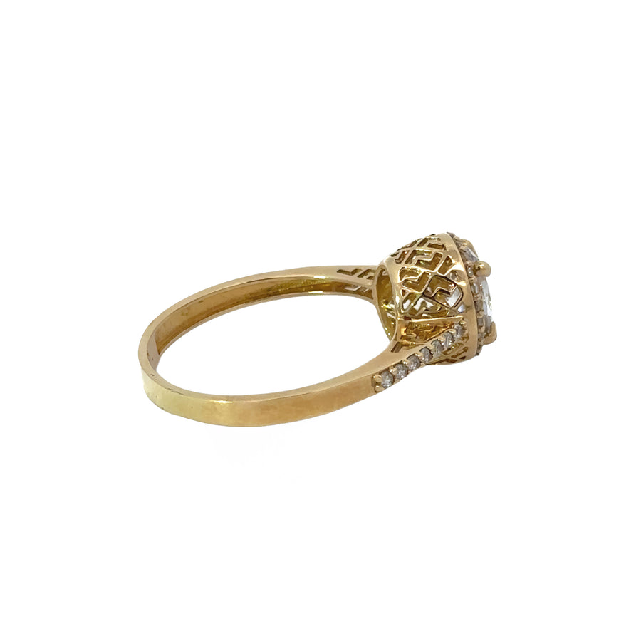 Side view of 14k gold ring with central cubic zirconia