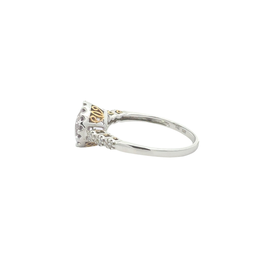 Close-up of diamond-studded 14k gold ring with smooth finish