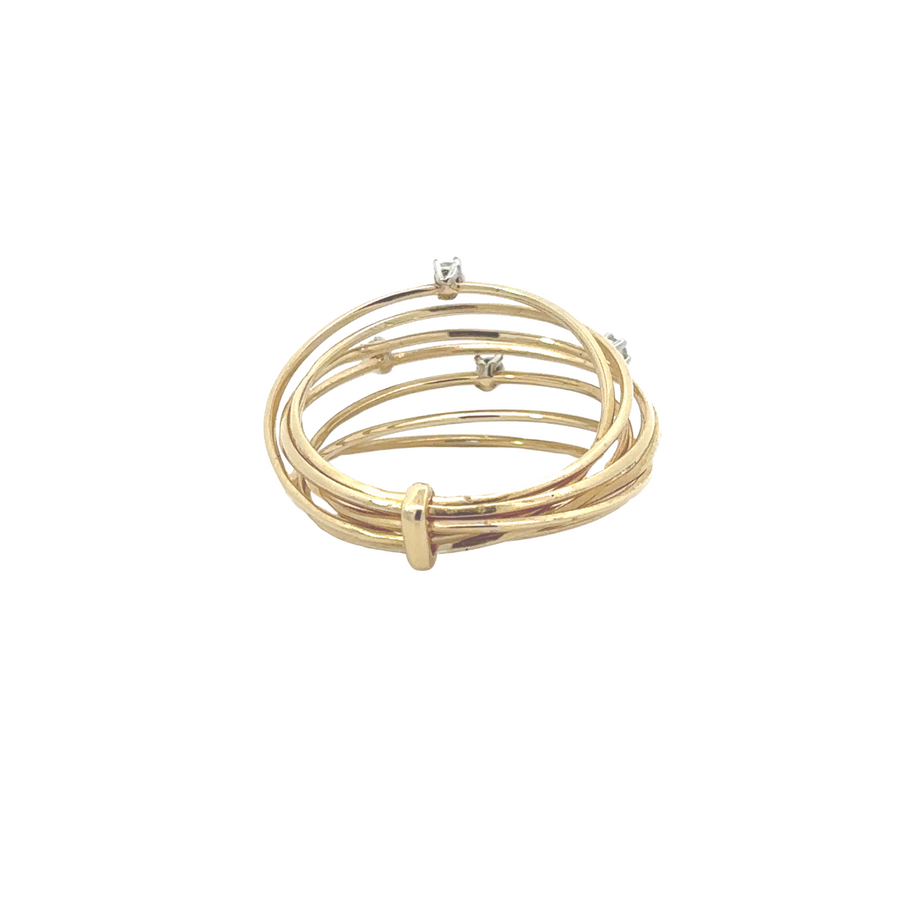 Close-up of diamonds set in a polished 14k gold band