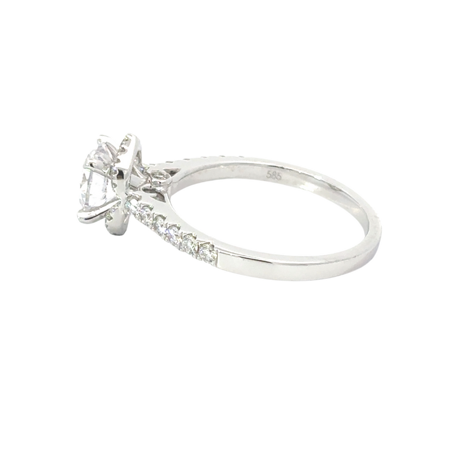 Side view of 14k gold diamond and CZ ring on white background