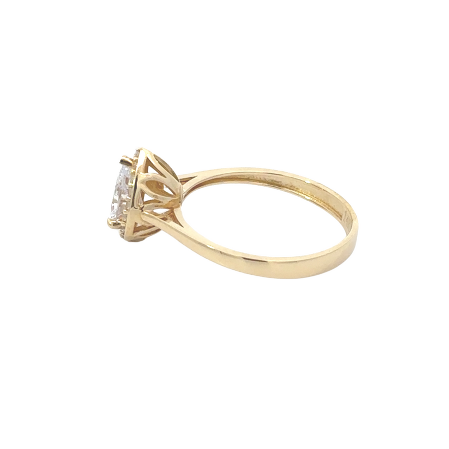 Elegant women’s gold ring with teardrop CZ centerpiece