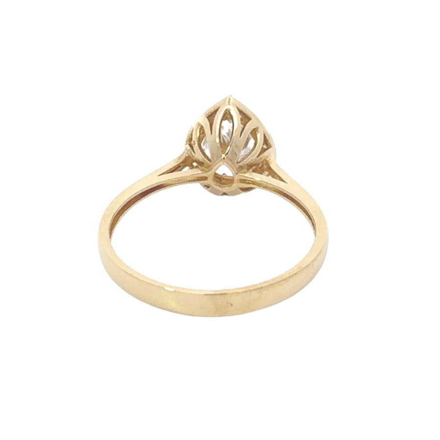 Timeless 14k gold ring featuring a teardrop cubic zirconia