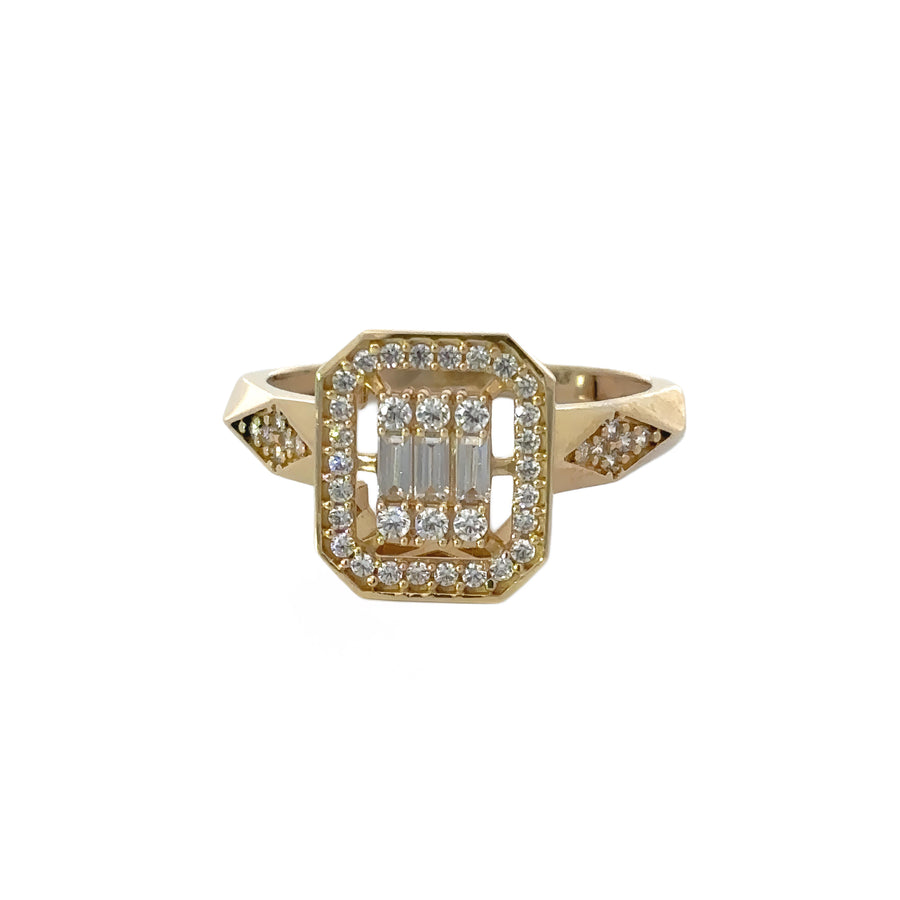 Close-up of 14k gold ring with romb-shaped cubic zirconia centerpiece
