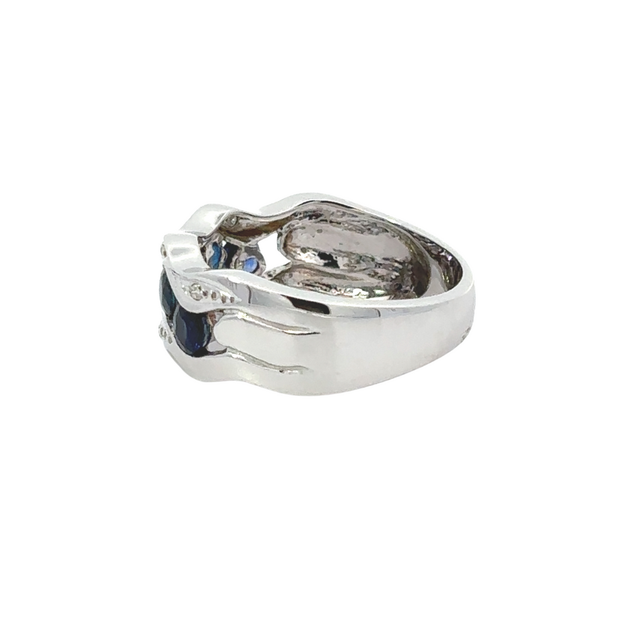 Side view of 14k gold sapphire ring with high-polish gold band and radiant diamonds