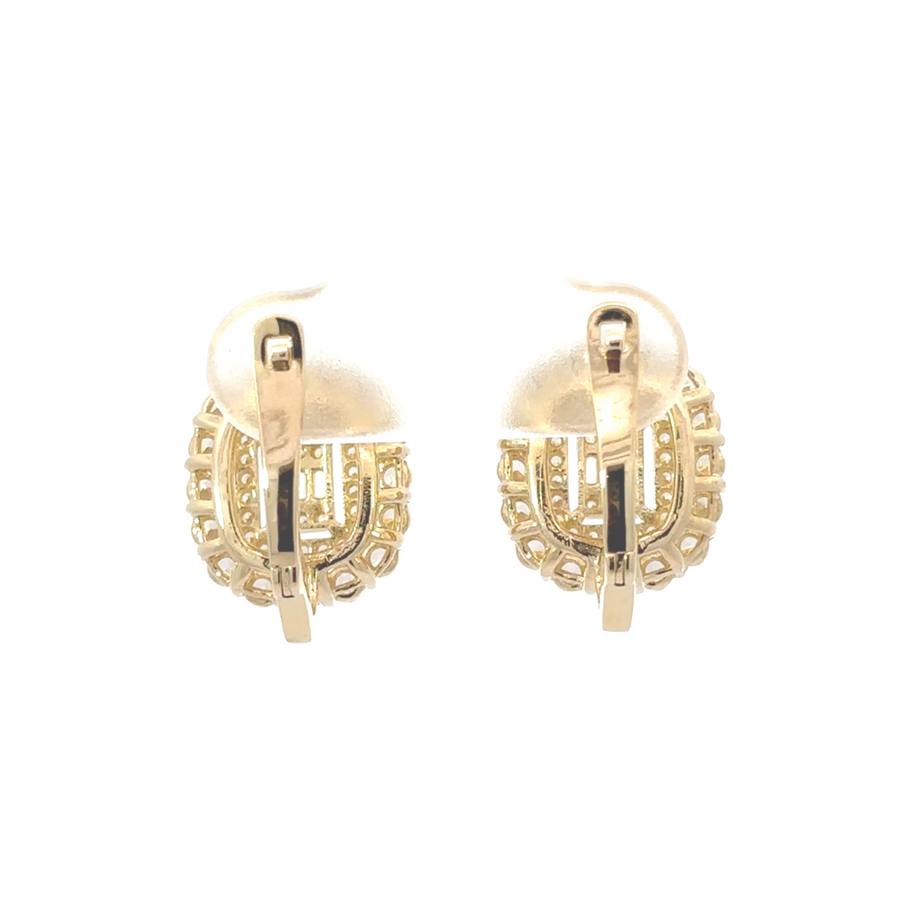 14k gold earrings with square pendant design placed on a velvet background