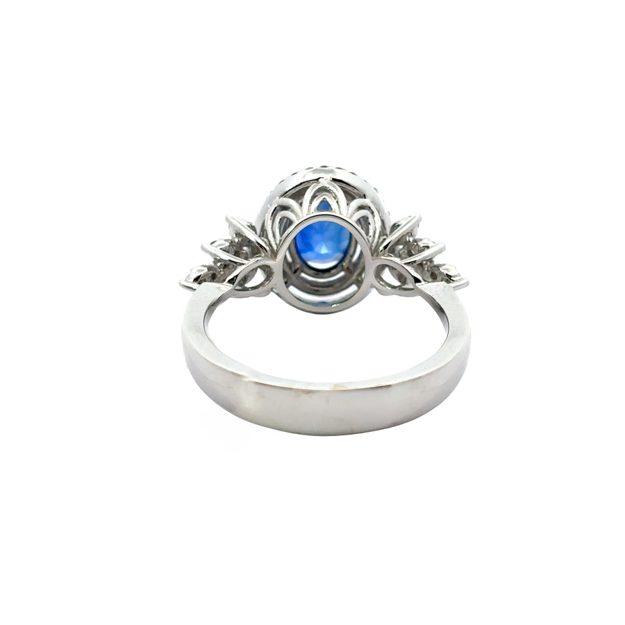 Detailed view of sapphire centerpiece surrounded by diamonds on ring