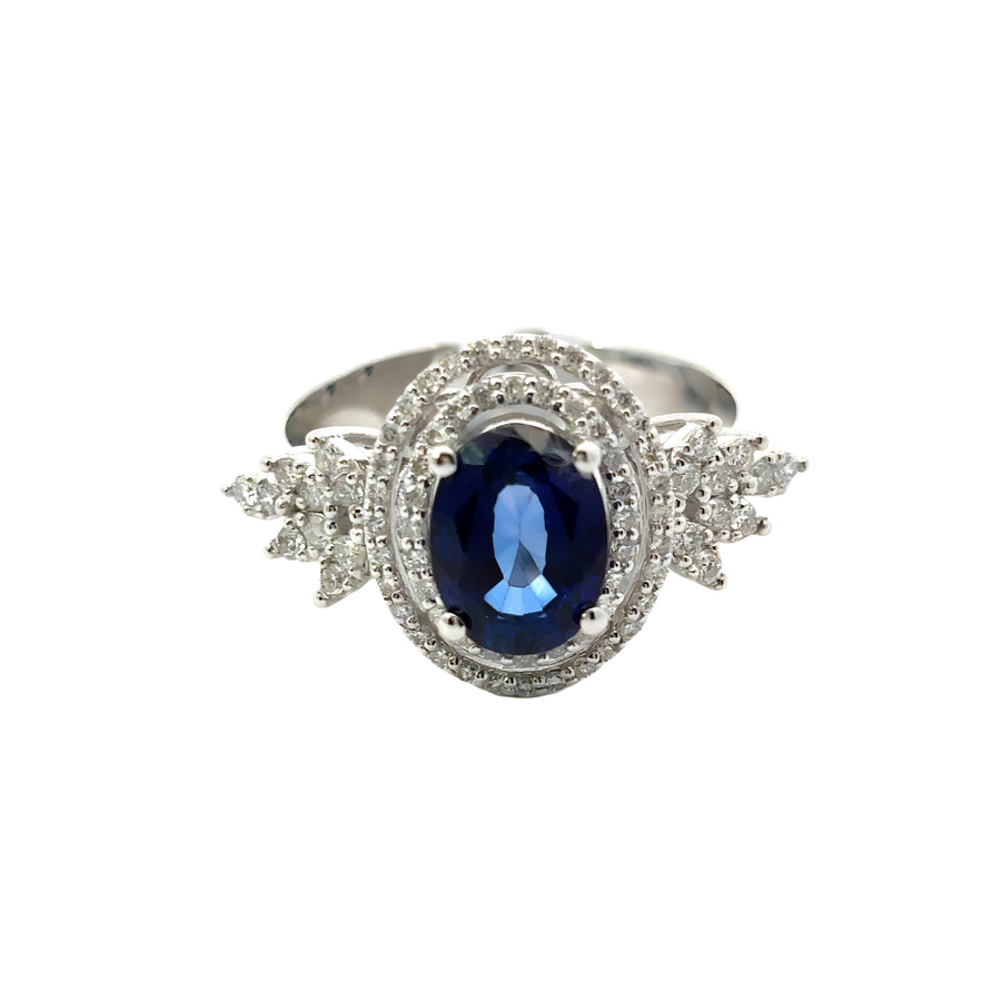 Elegant 14k gold ring featuring sparkling diamonds and blue sapphire