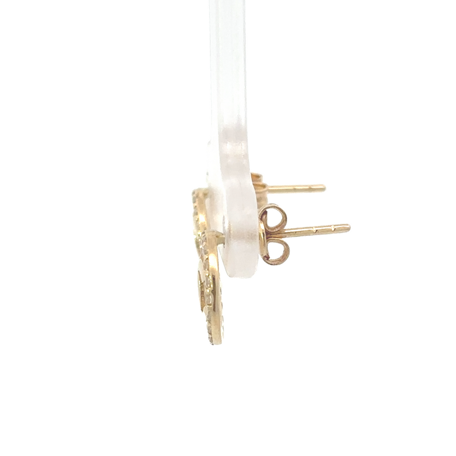 Side profile of earrings showing gold shine and round shape
