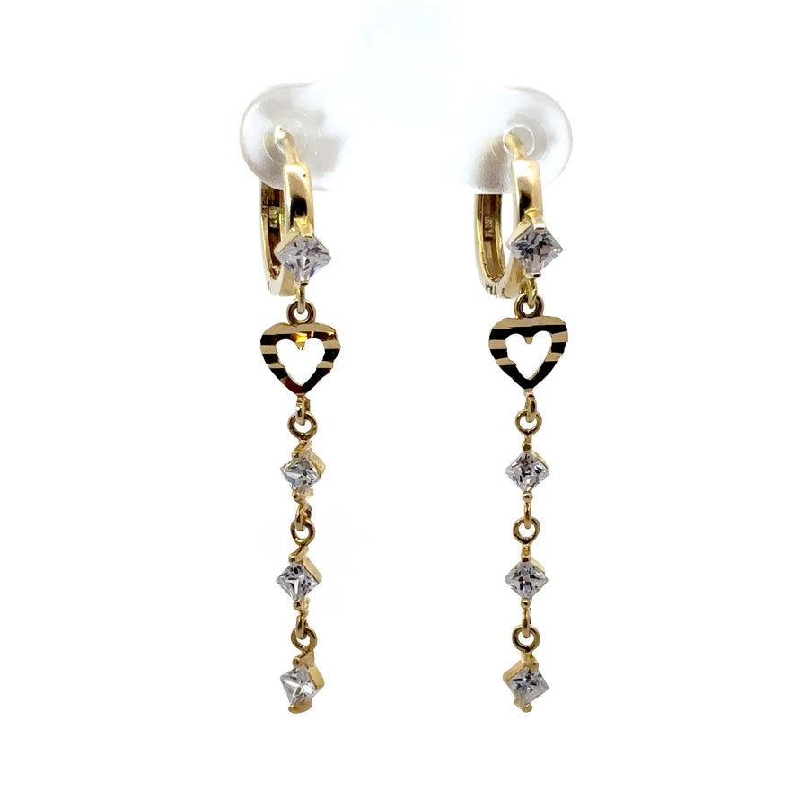 Woman wearing small gold huggies with heart and CZ accents