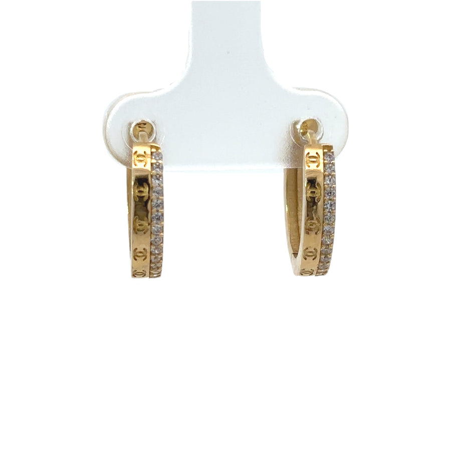 Woman wearing elegant 14k gold small stud earrings